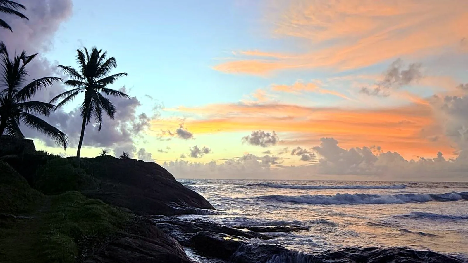 Sunset over the rocky point at Induruwa Beach