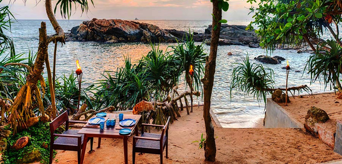 Dining in Galle Fort — oceanside restaurant with torches and sea views