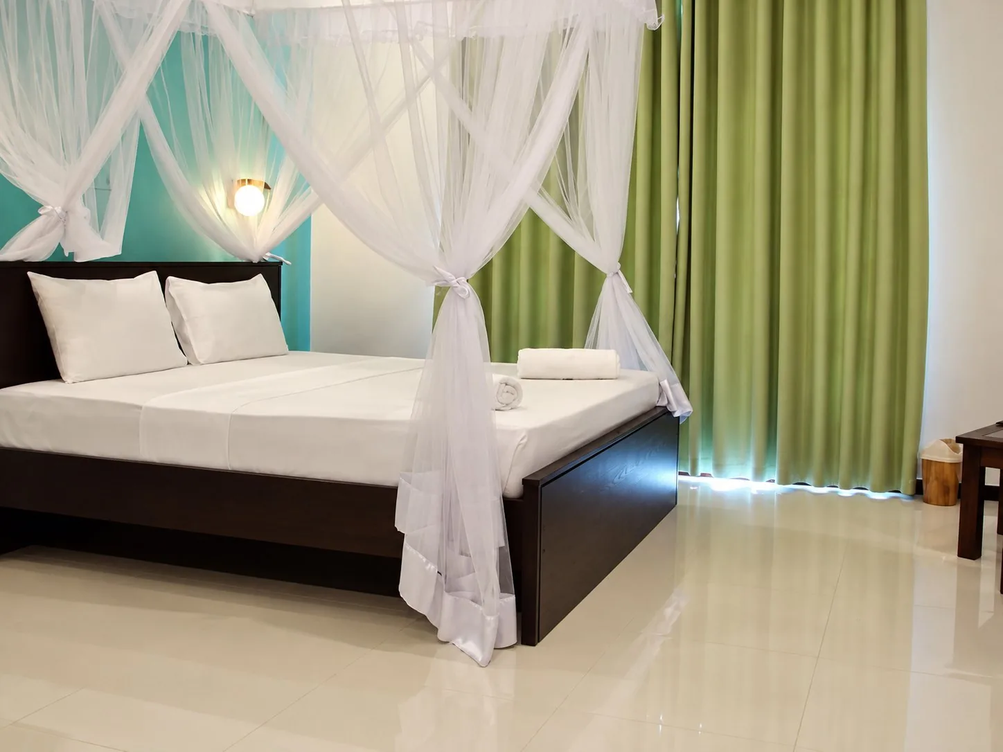 Deluxe Room canopy bedroom