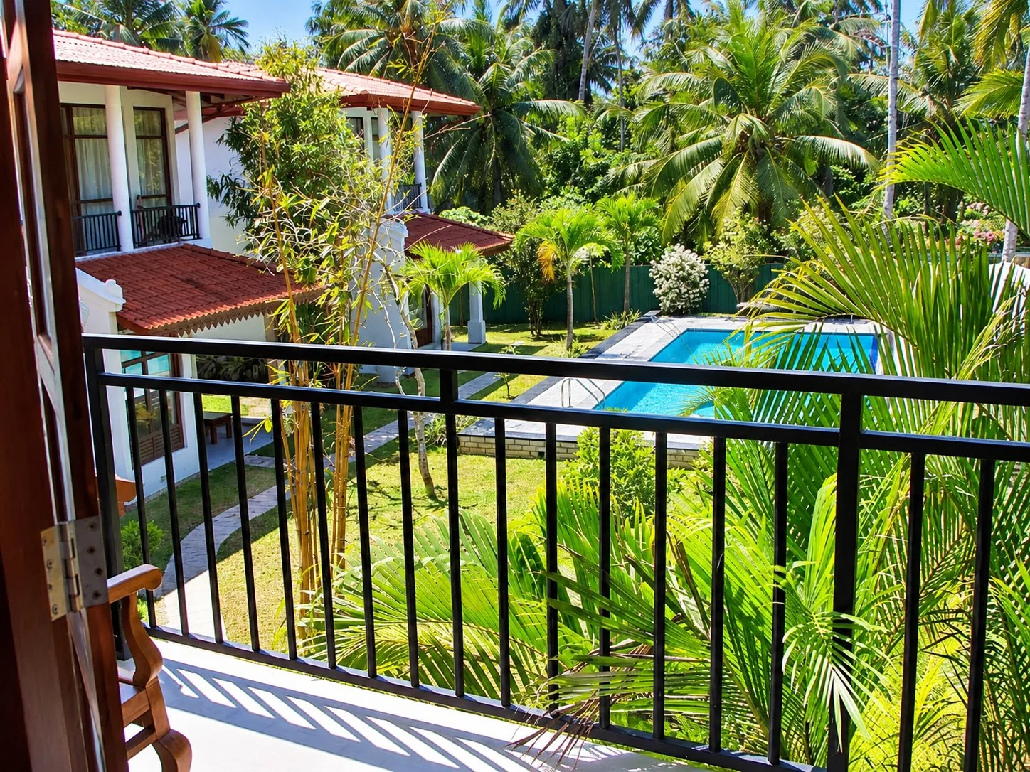 Villa Estuary Deluxe Room — balcony pool view