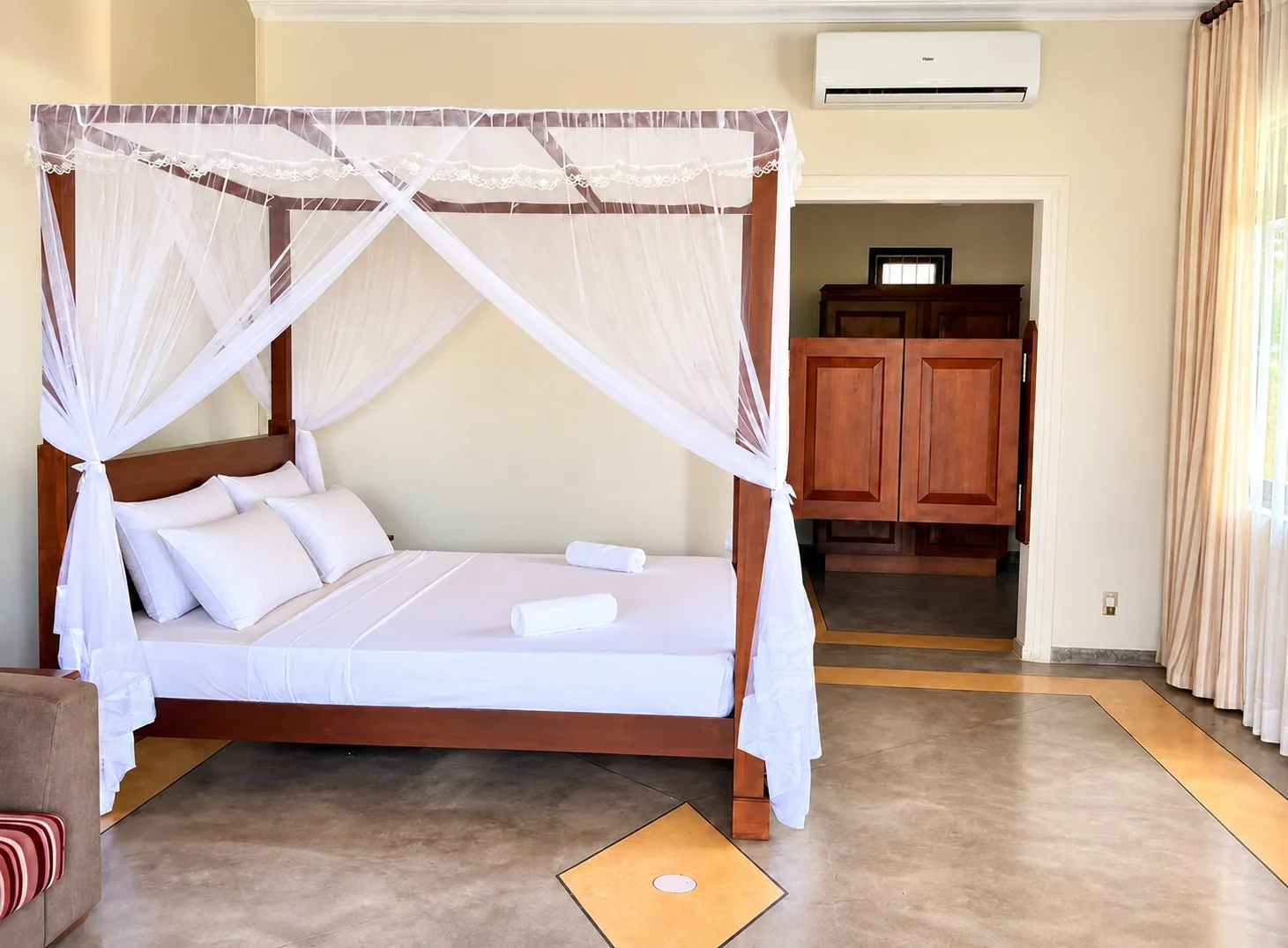 Estuary Suite first-floor king canopy bed with polished titanium floor