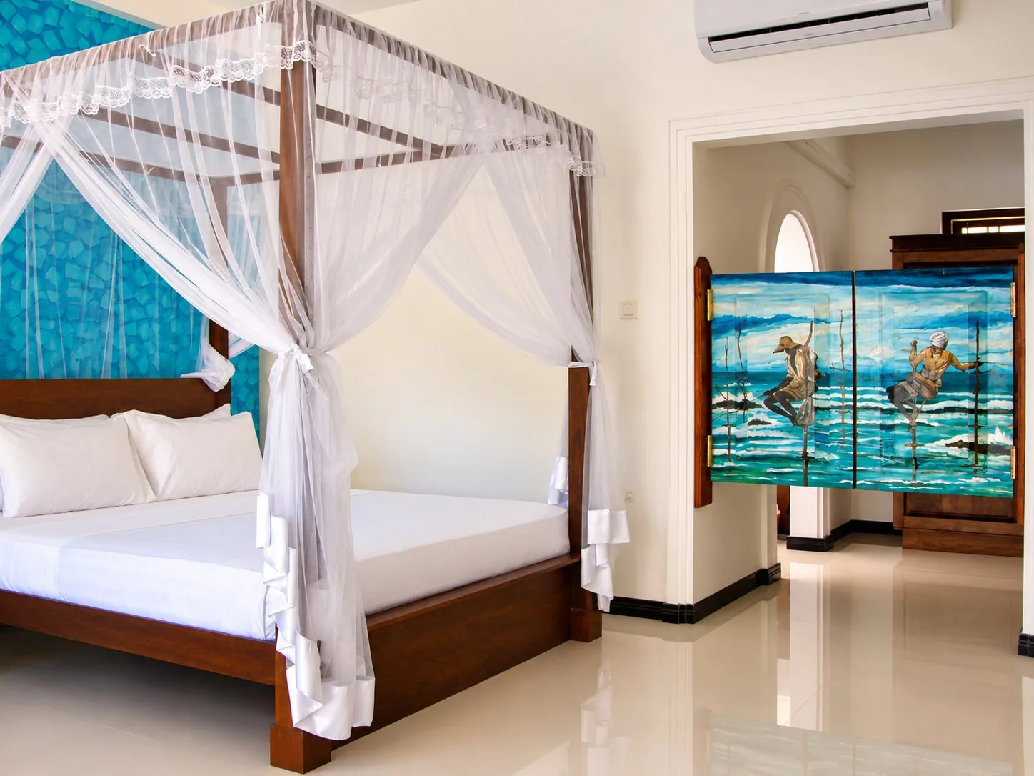 Garden Suite with hand-painted stilt fisherman doors and teal feature wall