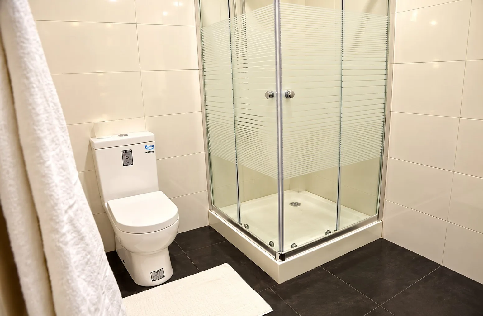 Garden Suite — glass shower enclosure (enclosure style varies between the two suites)